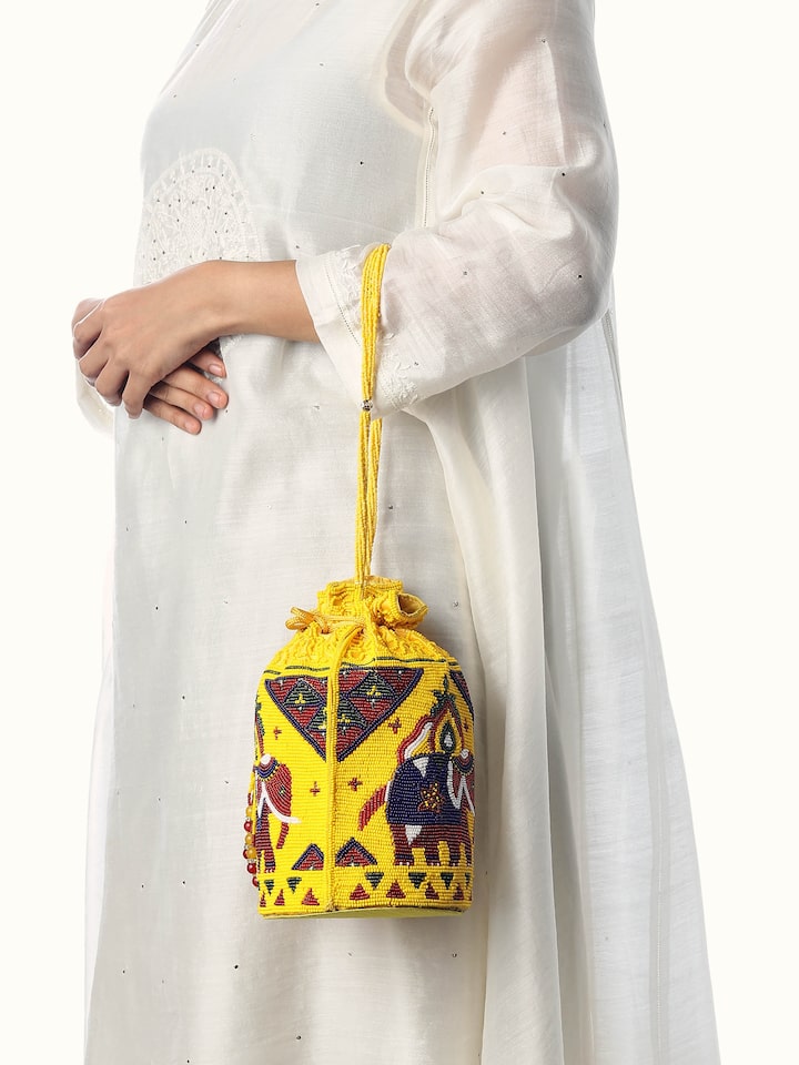 Styled view of Silk Beadwork Potli Bag showing the bag styled with an outfit