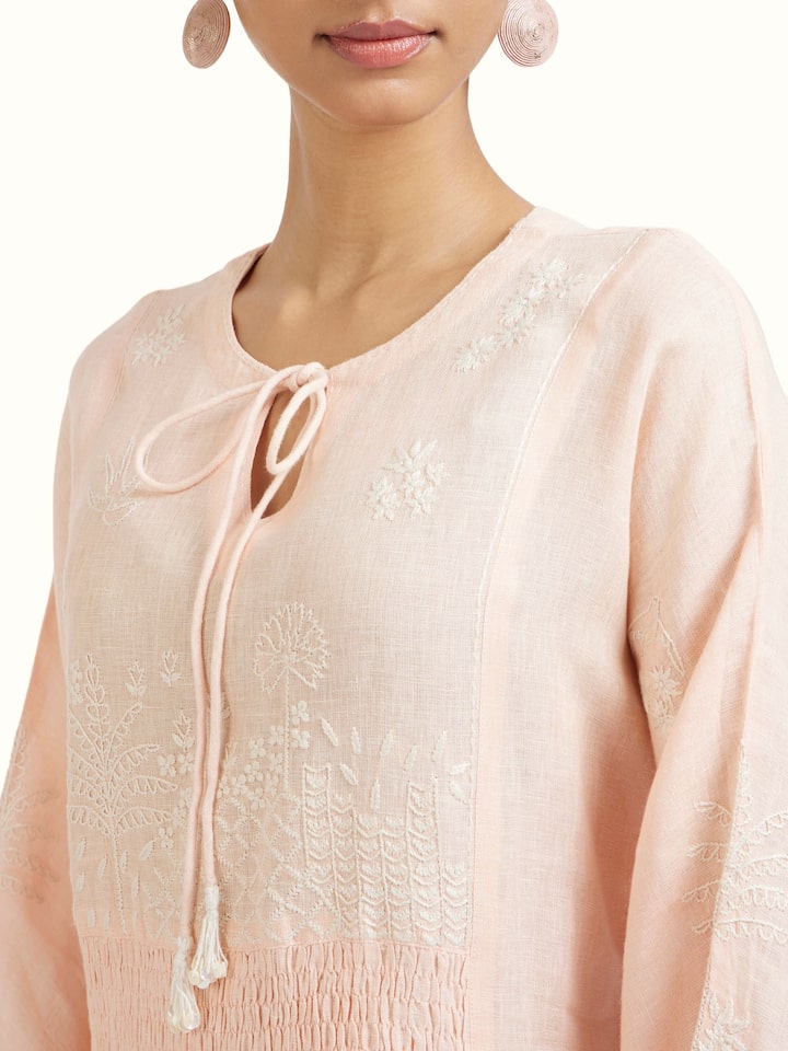 Detail view of Peach Linen Chikankari Dress highlighting the embroidery and stitch detail