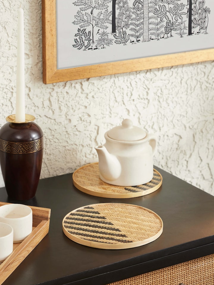 Top-down shot showing the round shape and intricate pattern of the bamboo trivets