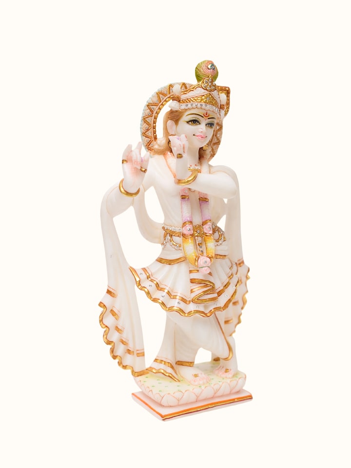 Angled view of the Marble Carved Krishna Idol
