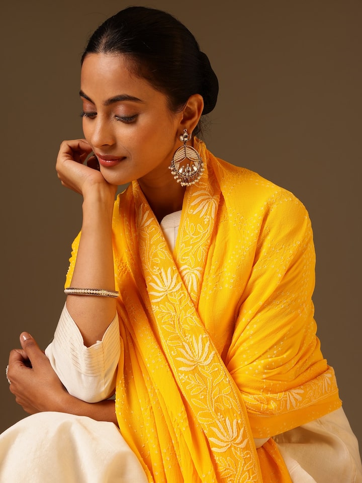 Detail view of yellow georgette bandhani tie and dye dupatta showing fabric texture