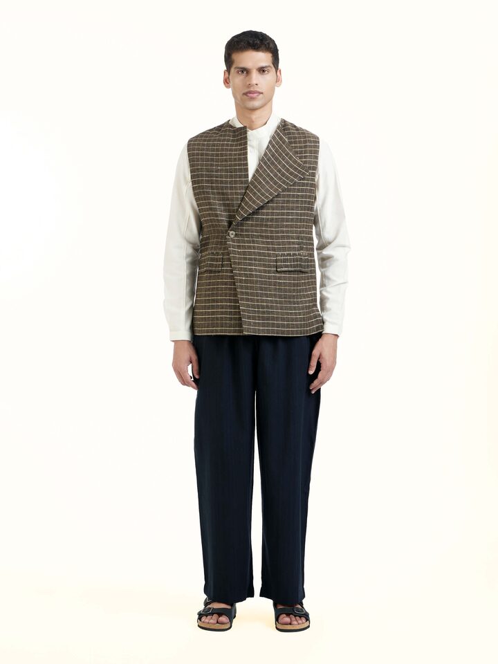 Front view of brown handloom sleeveless jacket with textured woven fabric