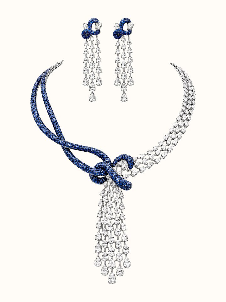 Front view of Open Setting 14 Karat White Gold Set with Diamonds, Sapphires And Rubies showing the complete piece and design
