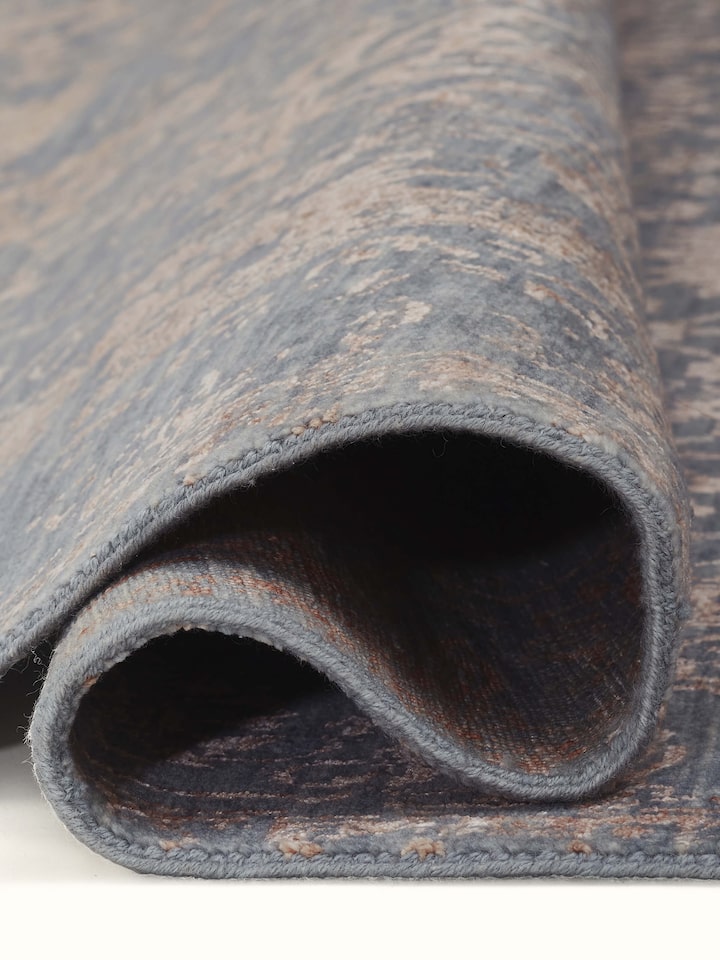Closer view of hand-knotting and color details on transitional carpet