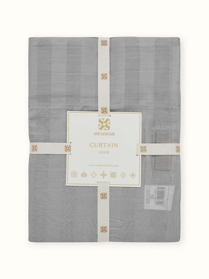 Detailed fabric shot of the wide stripes and delicate weave of the sheer curtain