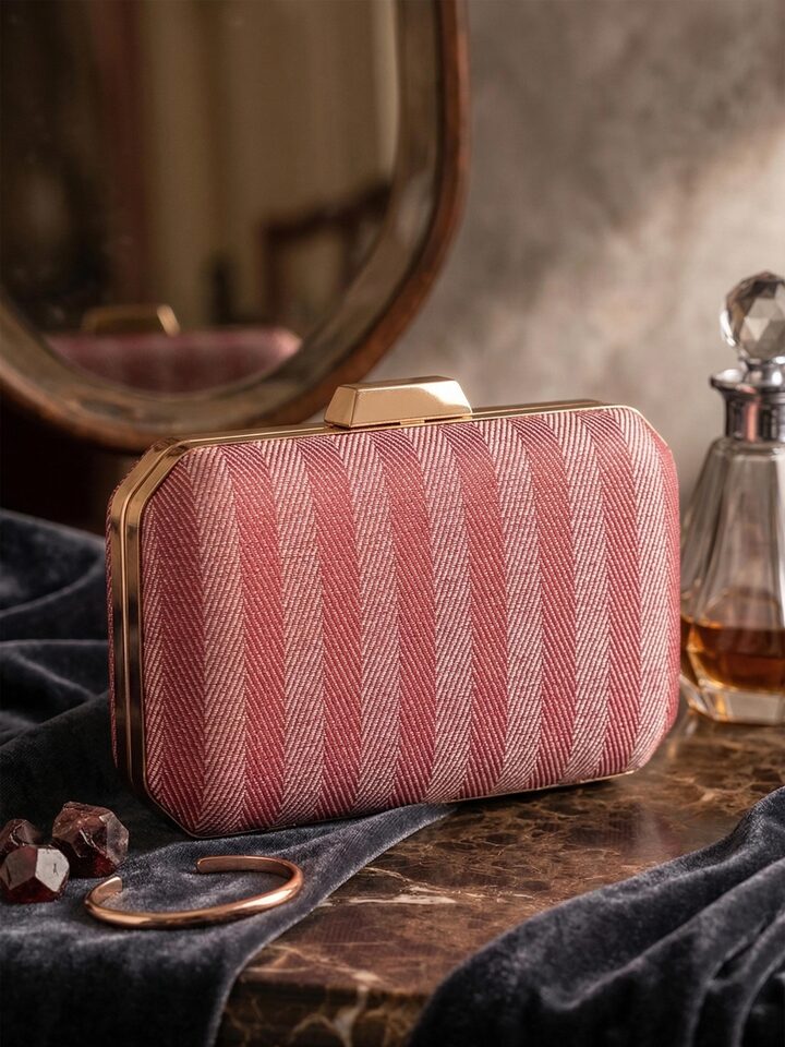 Styled view of Maroon Banarasi Silk Clutch showing the bag styled with an outfit