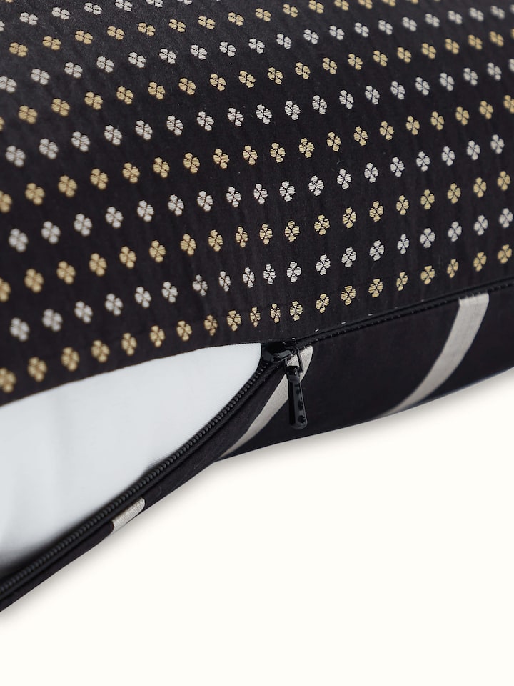 Angled view highlighting the sheen and texture of black striped Banarasi silk handloom cushion cover