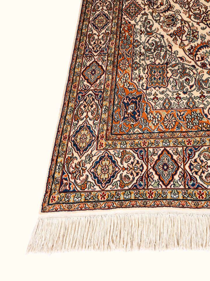 Traditional Persian ivory Sadakdar Kashmir silk hand-knotted runner, angled view showing design