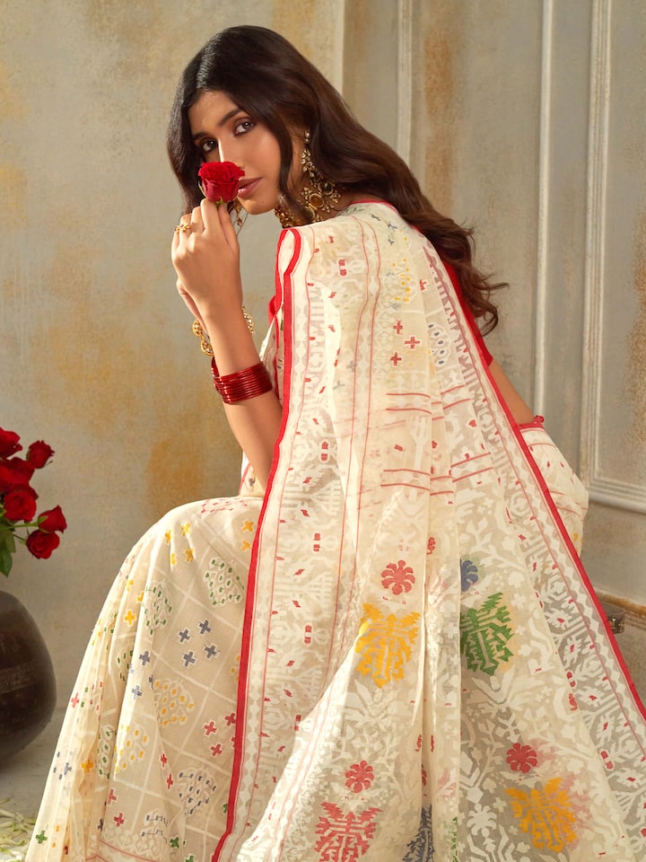 Angled view of white cotton Awadh Jamdani saree highlighting overall design and transparency