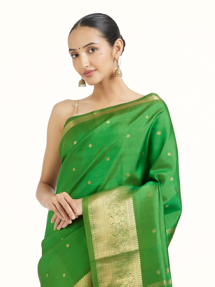 Angled view of green silk Kancheepuram saree highlighting traditional weave