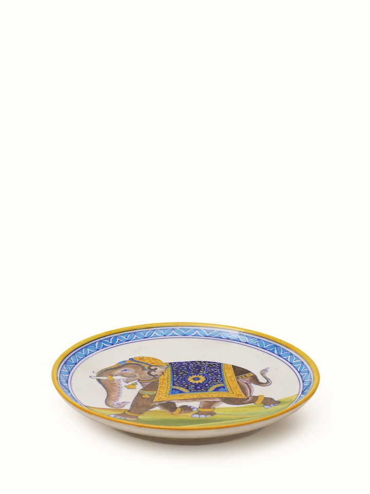 Angled view of Blue pottery Rajasthani warrior elephant display plate highlighting the vibrant artwork and detailed design