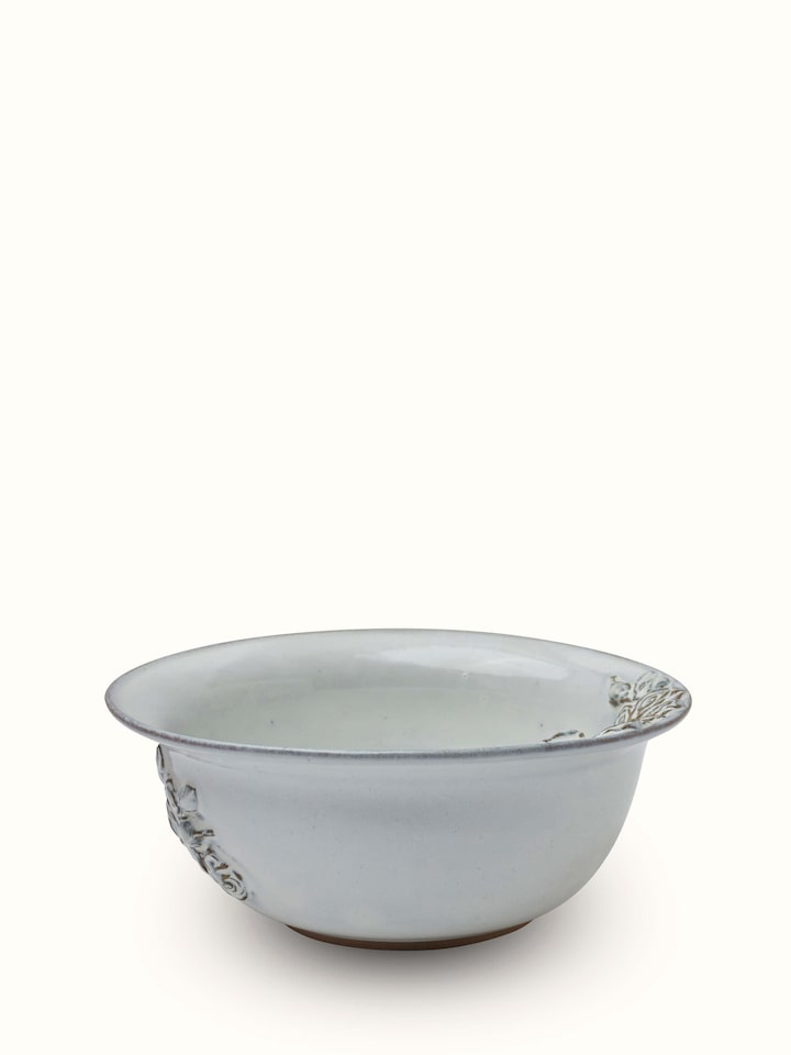 Angled view of Studio Pottery Ceramic Serving Bowl in white, emphasizing its elegant design and craftsmanship