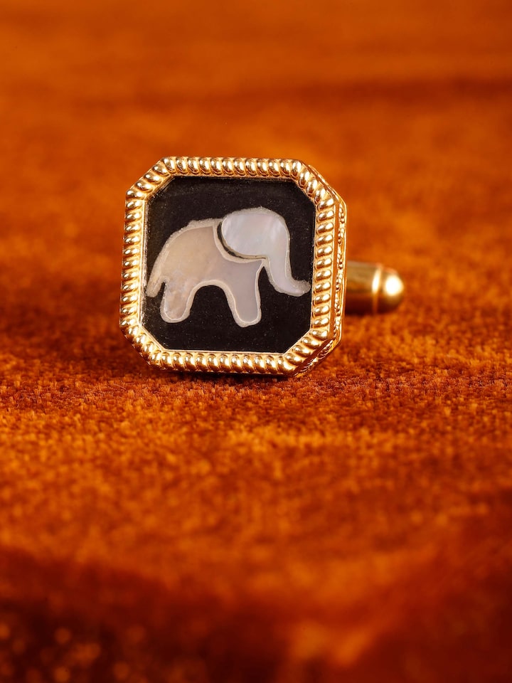 Close-up of Parchinkari inlay work on silver cufflinks