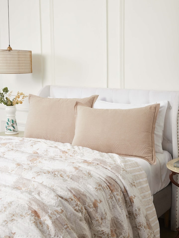 Lifestyle image showing Kahani Brown Kantha Embroidery Pillow Shams arranged on a bed