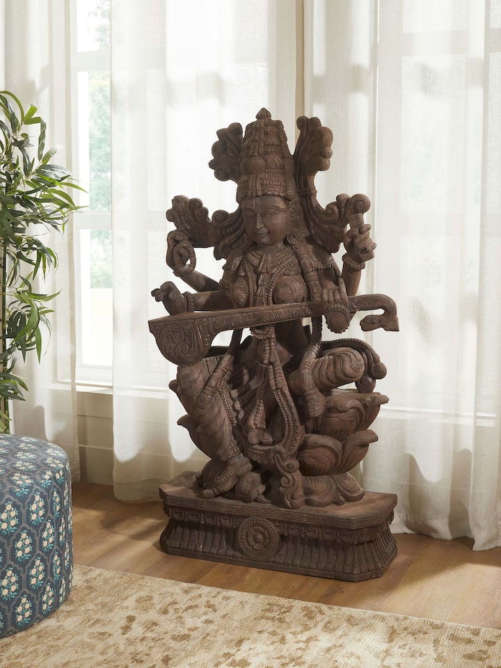 Left-side view of the Wood Carved Sitting Saraswati Idol