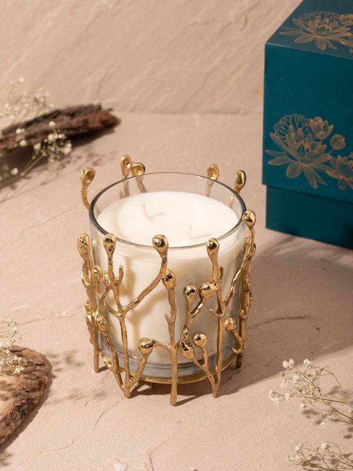 Side view of medium brass candle highlighting the intricate detailing and polished finish