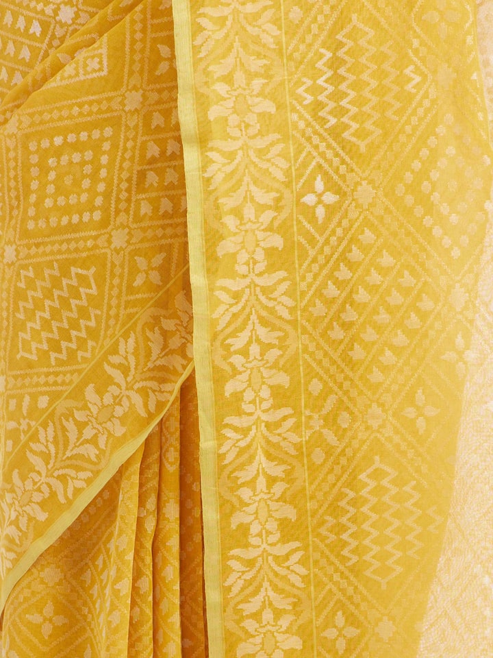 Detail view of yellow cotton Awadh Jamdani Banarasi saree showing handwoven texture