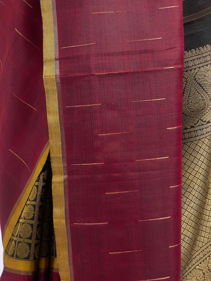 Detail view of brown silk Kancheepuram saree showing silk texture and zari craftsmanship