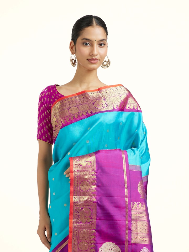 Angled view of the Turquoise Mulberry Silk Gadwal Handloom Zari Saree