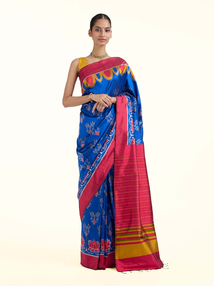 Front view of blue mulberry silk bandha Odisha ikat saree showcasing traditional motifs