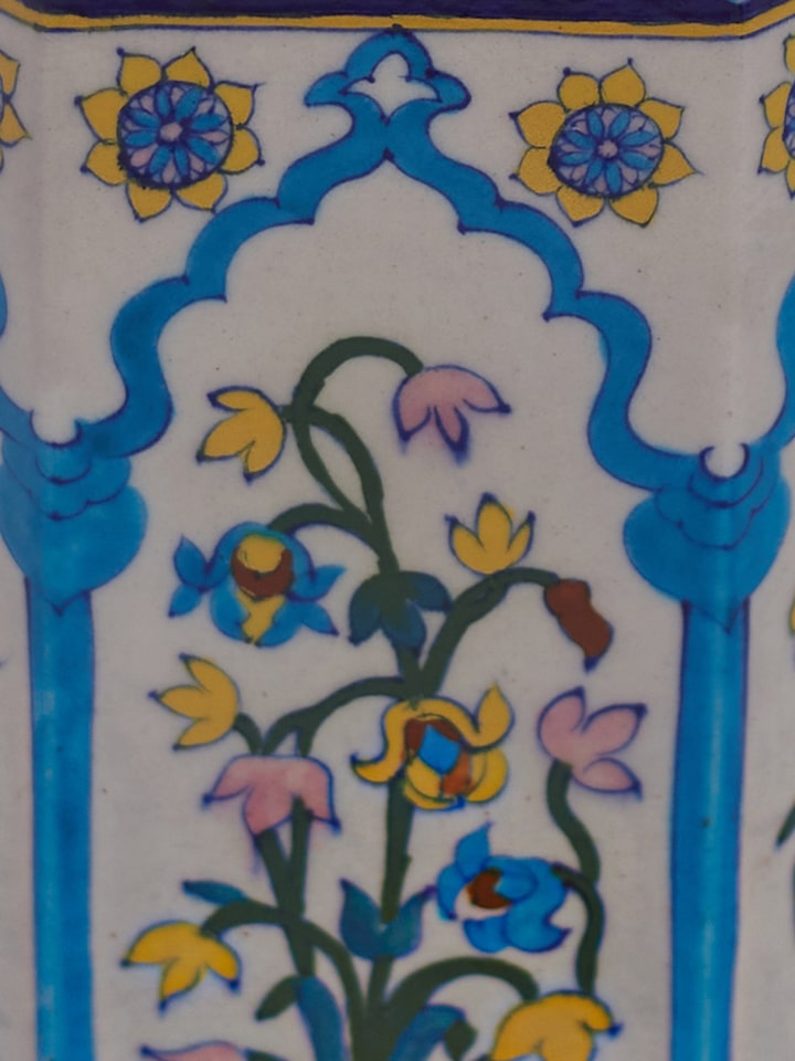 Detail close-up of blue pottery Jharokha ceramic planter showing painted patterns