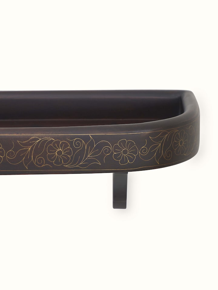 Detailed view of Sheesham Wood & Brass Tarkashi Wall Shelf, showcasing its polished wood and elegant brass inlay