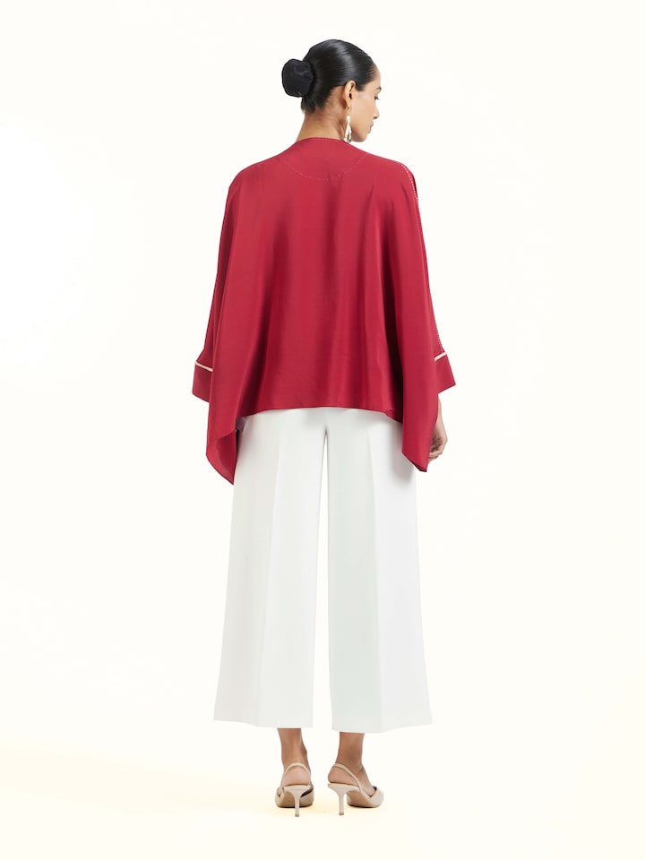 Back view of red silk handloom top displaying structured design