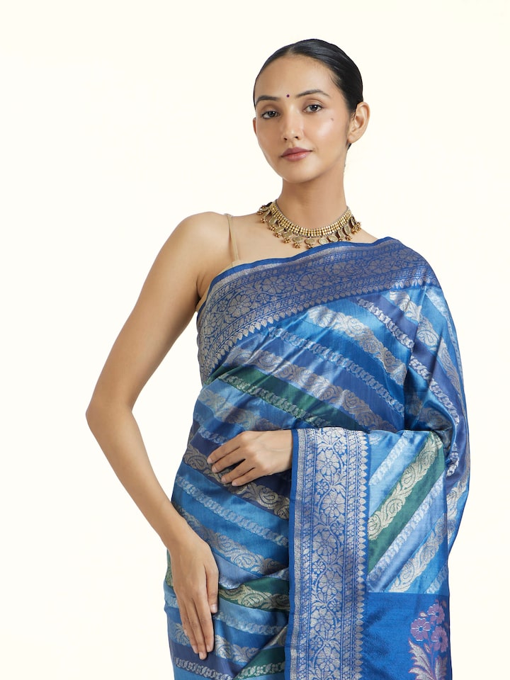 Angled view of Indigo Ashavali Brocade Silk Saree revealing the depth of its color and intricate pattern
