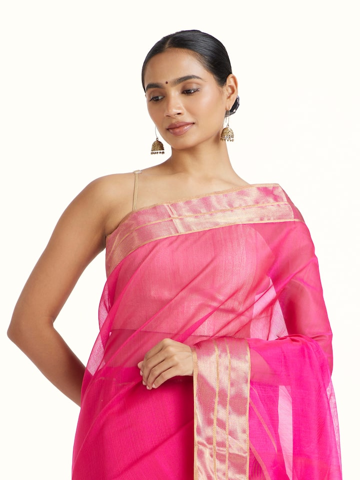 Angled view of Pink Mulberry Silk Chanderi Saree revealing the depth of its color and intricate pattern