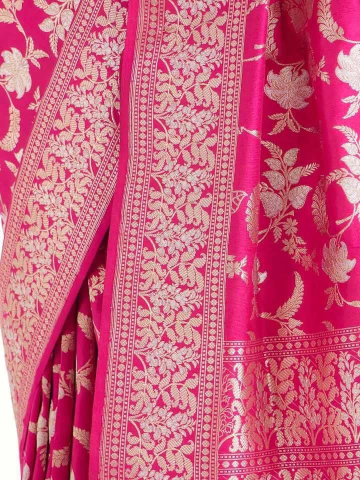 Detail view of pink silk Banarasi saree showing smooth silk texture and zari craftsmanship