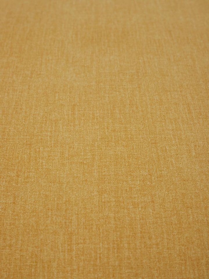 Close-up view of Upholstered Mahogany Wood Ottoman by Swadesh highlighting the soft fabric texture and fine stitching.