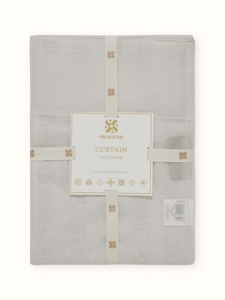 Detail shot highlighting texture and stripe variation on ivory sheer Maheshwari curtain.