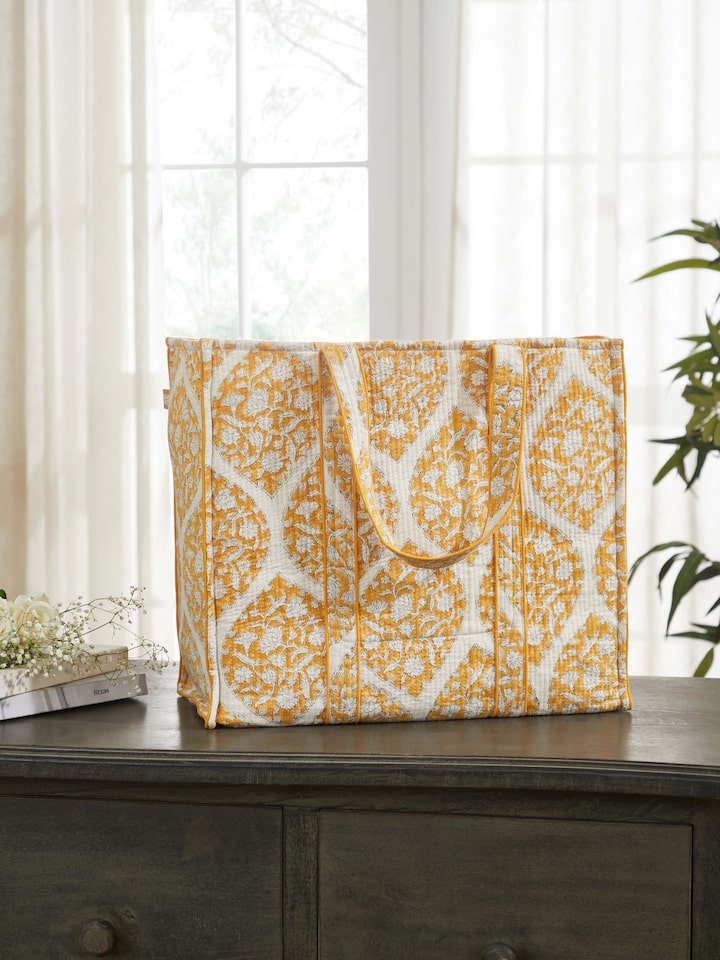 Side view of Yellow Handblock Printed Quilted Tote Bag showcasing the elegant drape and fabric texture