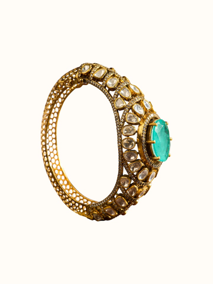 alternate angle view of silver smithing gold plated bangle