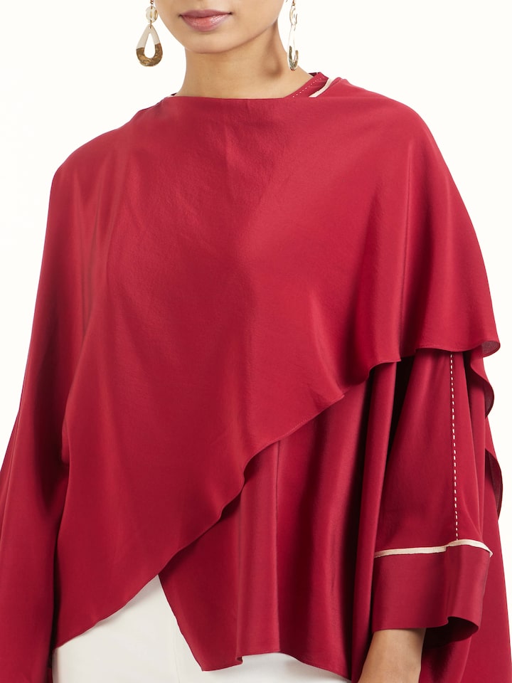 Detail view of red silk handloom top showing handwoven silk