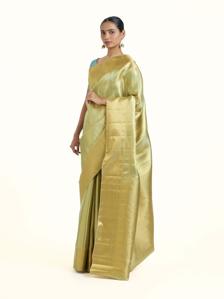 Side view of Green Kancheepuram Silk Zari Saree highlighting the detailed craftsmanship and elegant silhouette