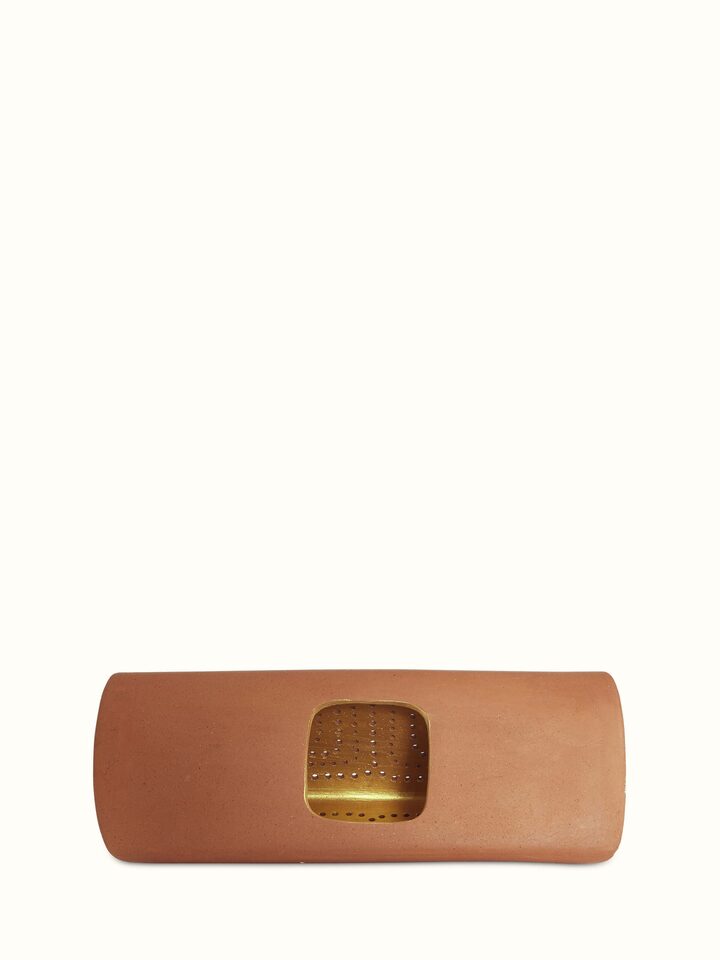 Side angle of terracotta wall light highlighting the traditional design and texture of the terracotta material
