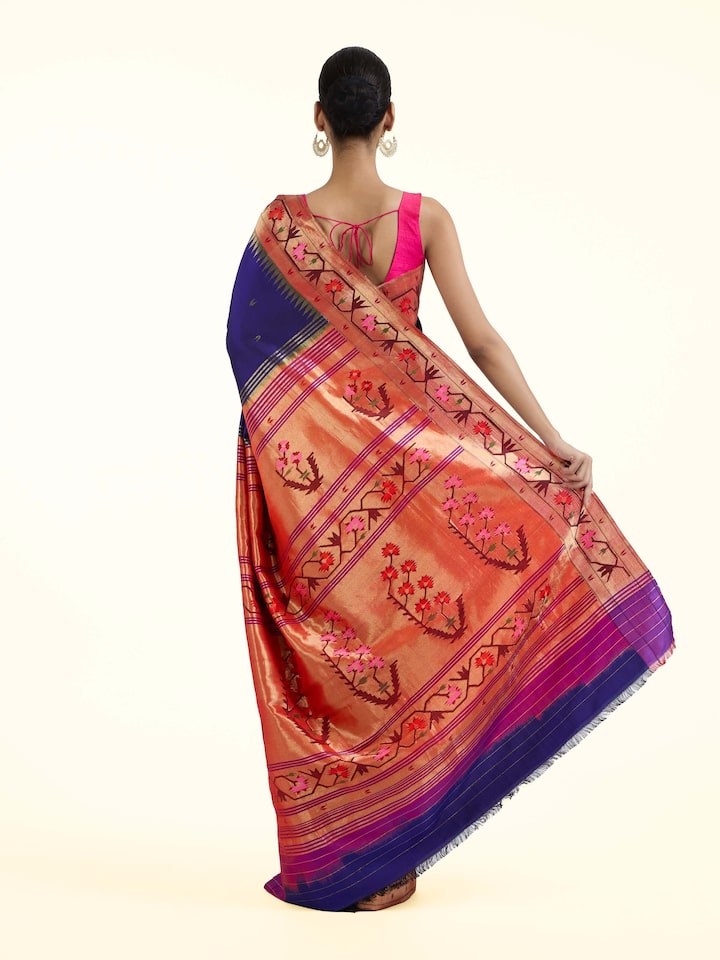 Back view of blue silk Paithani saree displaying ornate pallu
