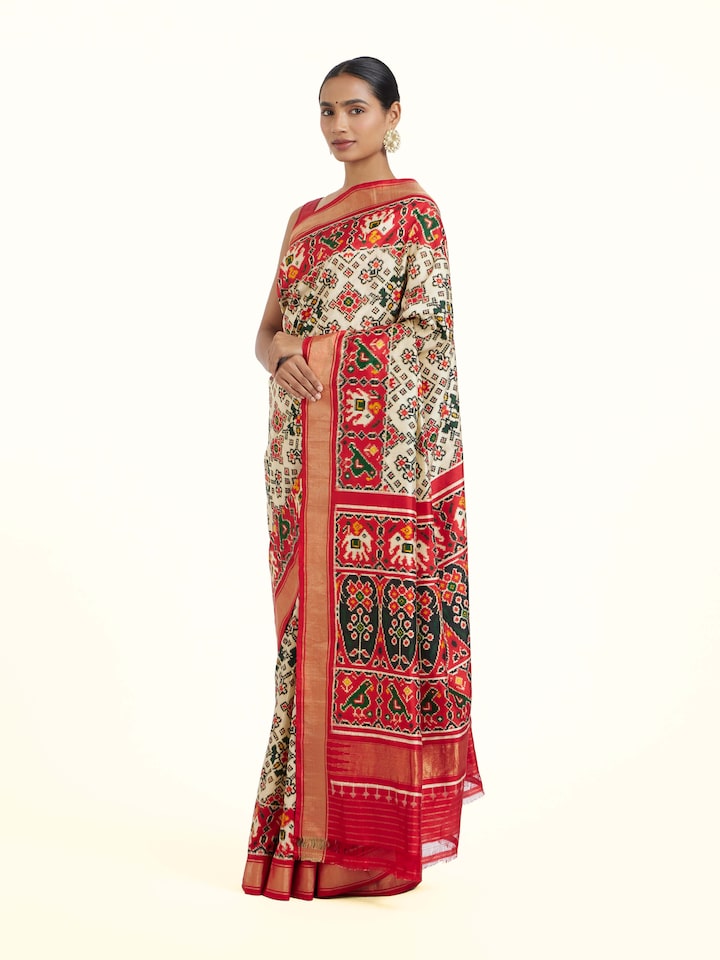 side view of cream pochampally double ikat silk saree drape