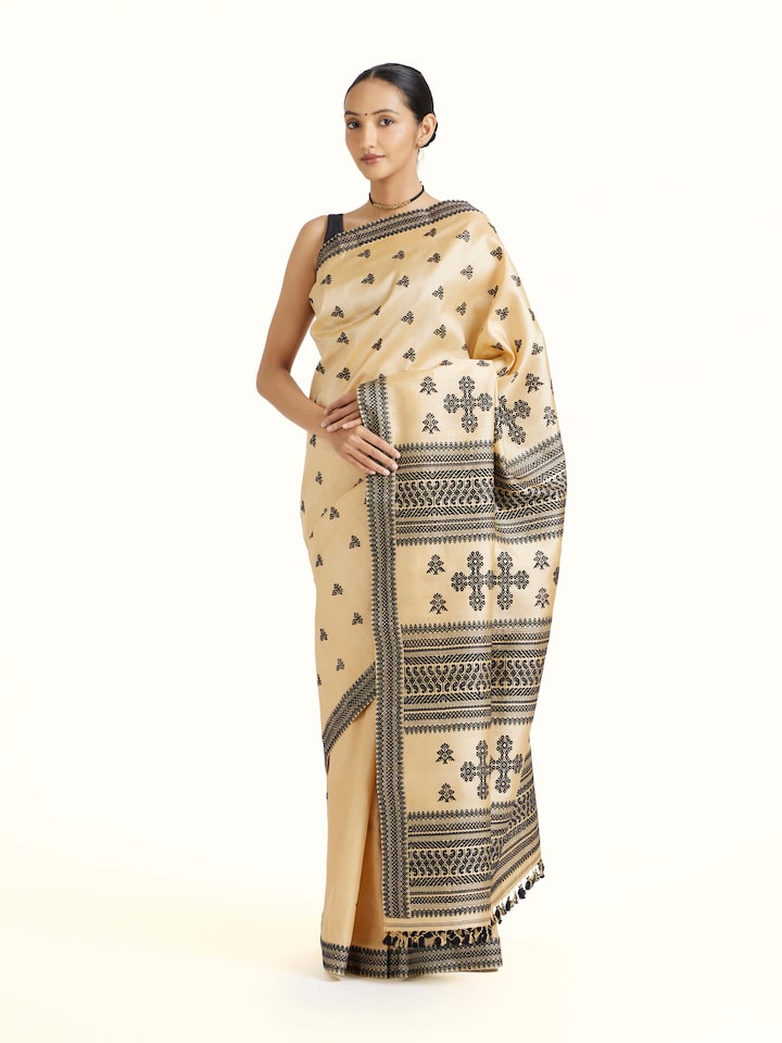 Side view of Beige Tussar Silk Saree highlighting the detailed craftsmanship and elegant silhouette