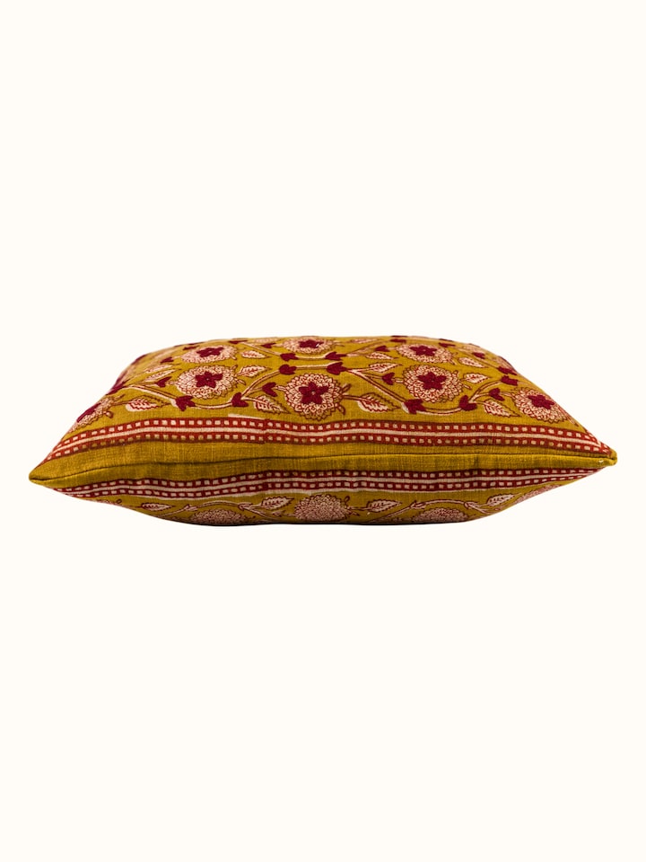 Side-angle view of the Marigold Hand Block Dabu With Embroidery Floral Cushion