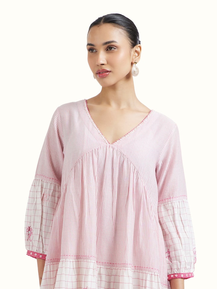 Angled view of Off white Bengal Handloom Dress revealing the depth of its color and intricate pattern
