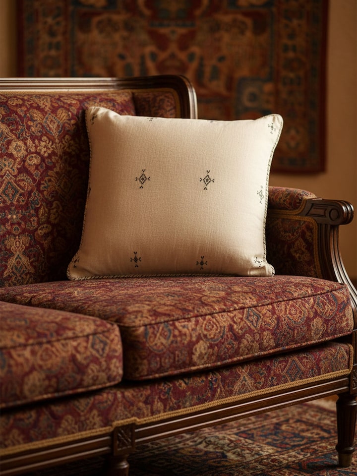 Folk geo hand embroidered cushion cover with detailed embroidery, lifestyle view