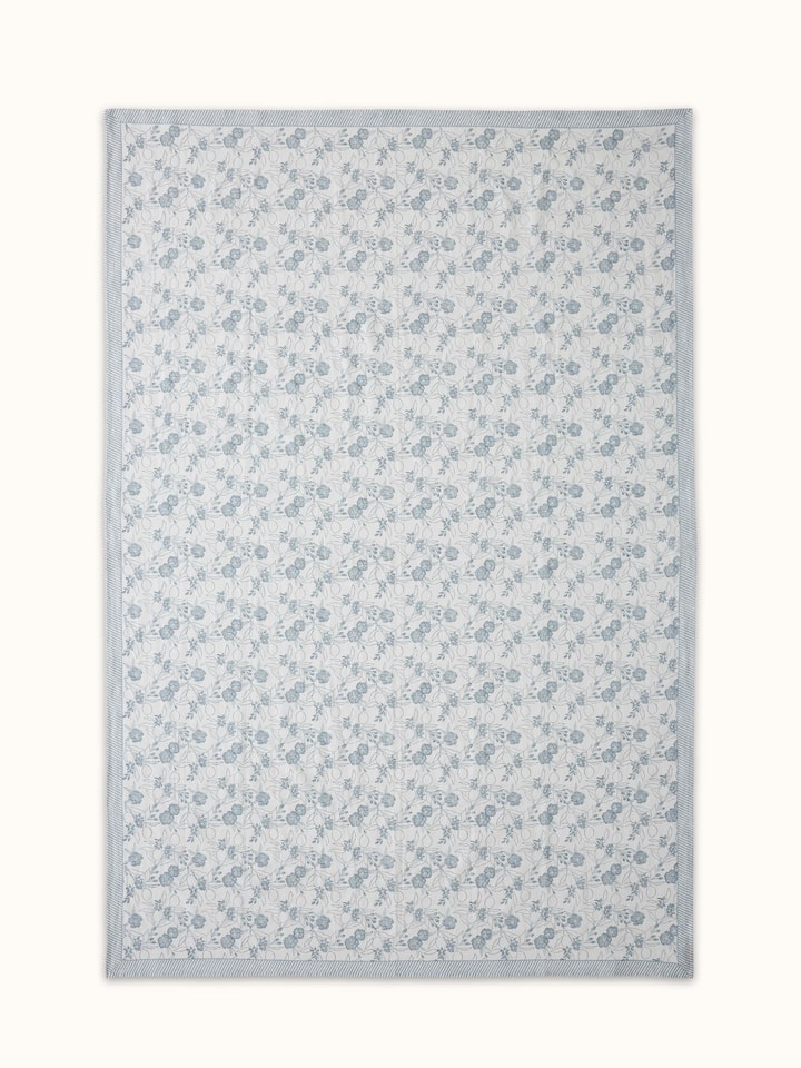Front view highlighting the floral patterns and linen texture