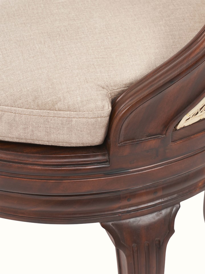 Detailed view of upholstered Mahogany wood study chair highlighting fabric upholstery and fine woodwork