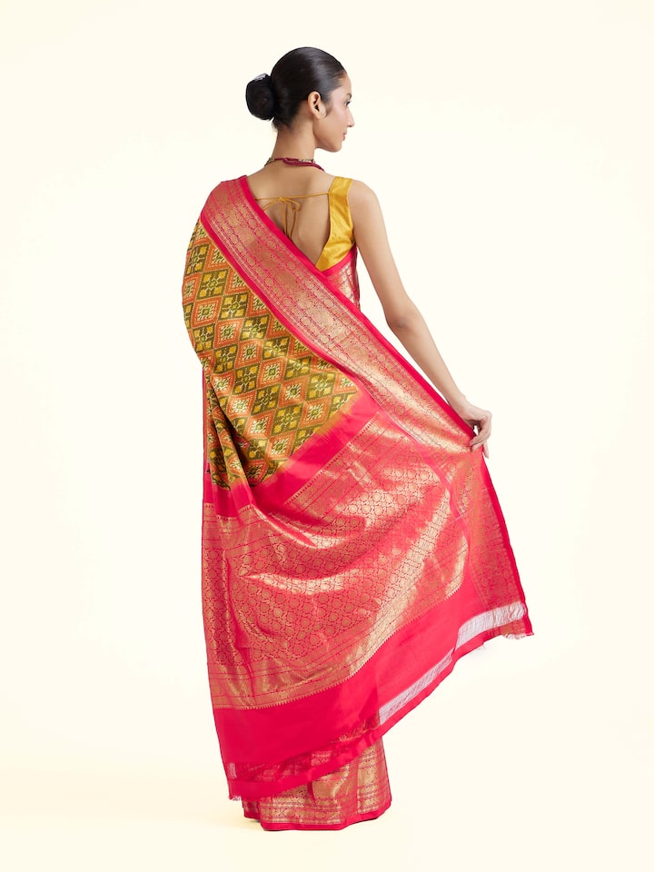 Back view of green silk ikat saree displaying pallu design