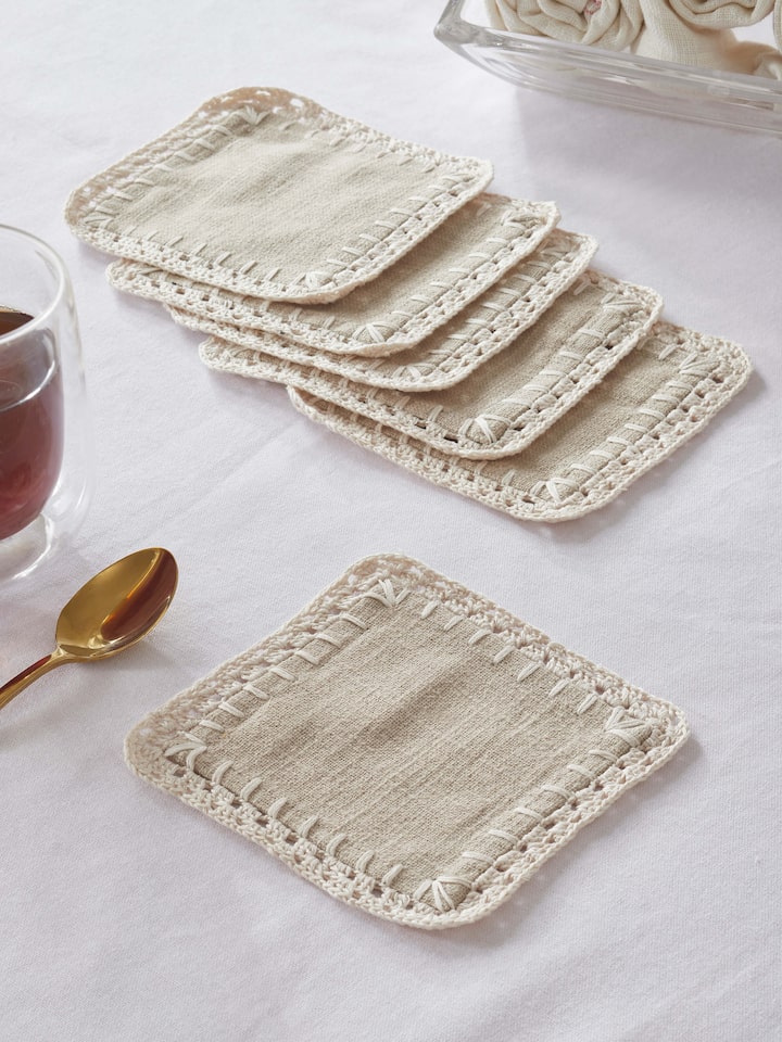 Styled view of Nityam Beige Cotton Slub Crochet Coaster (6 Pcs) styled on a table or bed setting