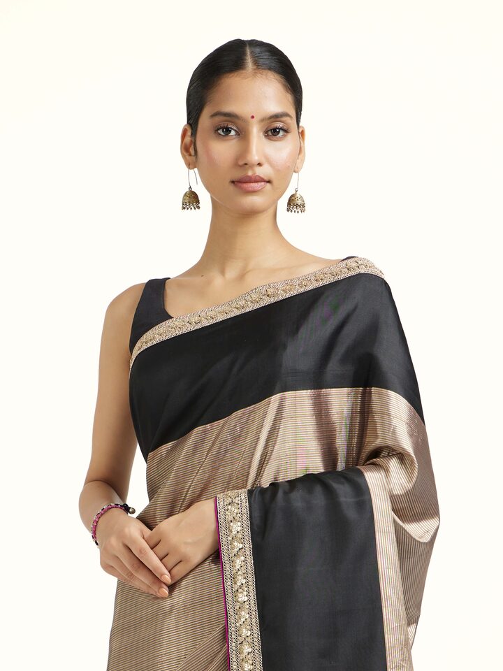 Close-up view of Black Silk Kancheepuram Aari Embroidered Saree highlighting the handwoven motif and texture