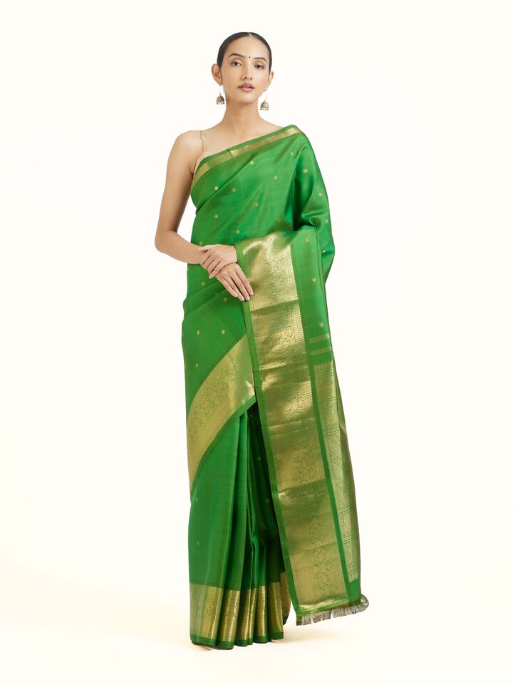 Front view of green silk Kancheepuram saree with rich zari motifs