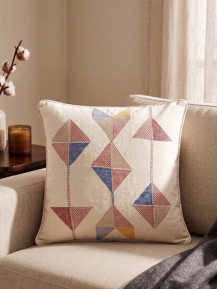 Lifestyle view of the Swadesh Uttarayan Hand Embroidered Cotton Cushion Cover